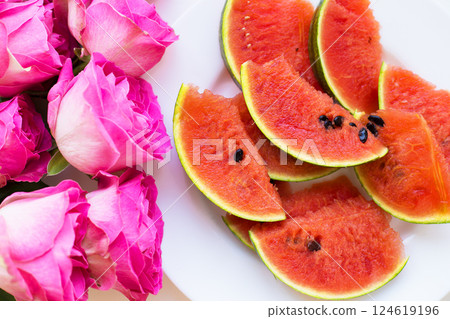 bouquet of pink roses on the table with watermelon 124619196