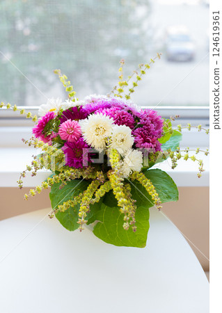 bouquet of white and pink chrysanthemums stood on the table bouquet of white and pink chrysanthemums stood on the table 124619361