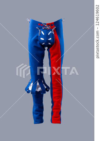 Colorful Medieval Wool Hose with Unique Design. Eye-catching legwear featuring vibrant blue and red sections with decorative details. 124619602