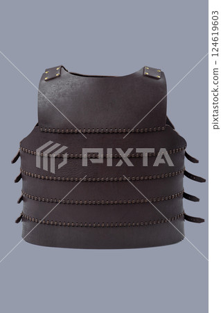 Brown Leather Medieval Torso Armor with Buckles. This brown leather cuirass features adjustable straps and brass buckles, providing torso protection. Brown Leather Medieval Torso Armor with Buckles. This brown leather cuirass features adjustable straps and brass buckles, providing torso protection. 124619603