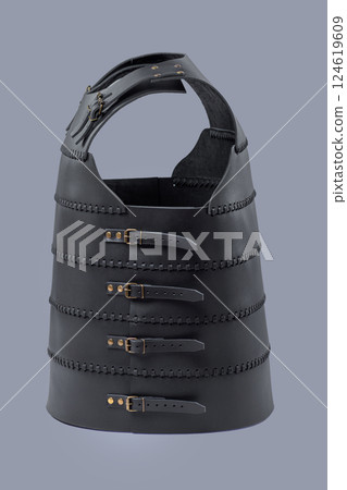 Black Leather Cuirass. Medieval torso armor with adjustable straps and buckles. Black Leather Cuirass. Medieval torso armor with adjustable straps and buckles. 124619609