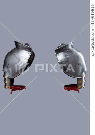 Medieval Steel Shoulder Armor with Gorget. Set of polished spaulders providing protection for the shoulders and upper chest. Medieval Steel Shoulder Armor with Gorget. Set of polished spaulders providing protection for the shoulders and upper chest. 124619619