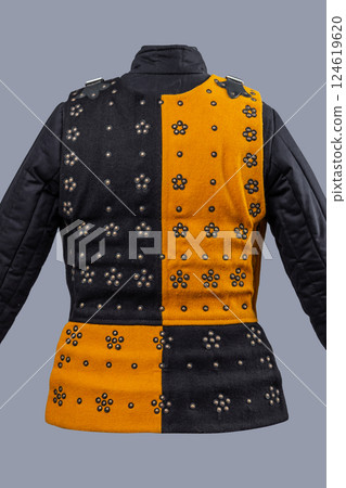 Two-Tone Medieval Brigandine Armor with Buckles. Unique torso protection featuring contrasting yellow and black panels with decorative rivets and leather strap closures. 124619620