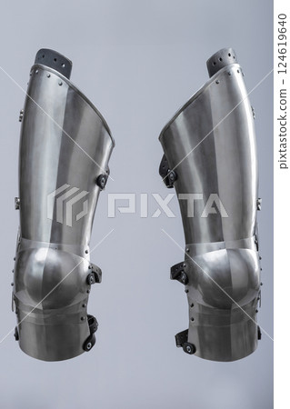 Steel Plate Leg Armor for Medieval Knight. Full leg protection with articulated segments from knee to ankle. 124619640