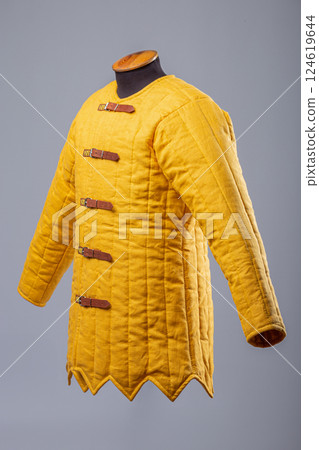 Yellow Padded Gambeson Jacket. Medieval quilted under-armor with leather strap closures. Yellow Padded Gambeson Jacket. Medieval quilted under-armor with leather strap closures. 124619644