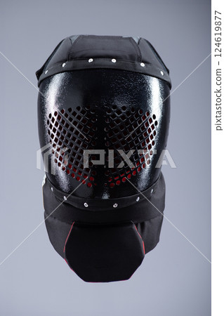 Black Buhurt Training Helmet with Dragon Design. Robust head protection designed for medieval combat sports and rigorous training. Black Buhurt Training Helmet with Dragon Design. Robust head protection designed for medieval combat sports and rigorous training. 124619877