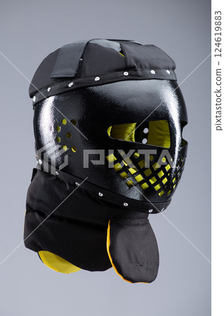 Modern Black Training Helmet for Medieval Combat. Protective headgear designed for historical martial arts and full-contact fighting. Modern Black Training Helmet for Medieval Combat. Protective headgear designed for historical martial arts and full-contact fighting. 124619883