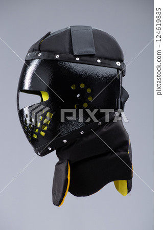 Modern Black Training Helmet for Medieval Combat. Protective headgear designed for historical martial arts and full-contact fighting. Modern Black Training Helmet for Medieval Combat. Protective headgear designed for historical martial arts and full-contact fighting. 124619885