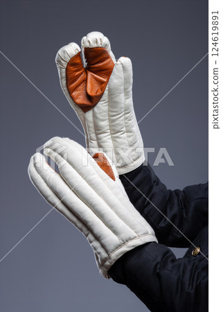 Reinforced Medieval Gauntlets with Knuckle Protection. Sturdy handwear featuring padded fabric and a durable leather reinforcement across the knuckles. 124619891