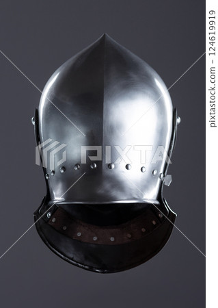 Polished Silver Medieval Armet Helmet with Perforated Visor. This shiny silver armet features a rounded skull, a protective bevor, and a visor with multiple small perforations. Polished Silver Medieval Armet Helmet with Perforated Visor. This shiny silver armet features a rounded skull, a protective bevor, and a visor with multiple small perforations. 124619919