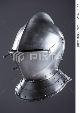 Shiny Silver Medieval Armet Helmet with Visor. This polished silver armet features a hinged visor and bevor, offering full head protection in medieval style. Shiny Silver Medieval Armet Helmet with Visor. This polished silver armet features a hinged visor and bevor, offering full head protection in medieval style. 124619933