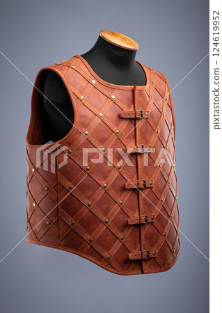 Brown Leather Medieval Armor Vest. Mercenary style torso protection with studded design. Brown Leather Medieval Armor Vest. Mercenary style torso protection with studded design. 124619952