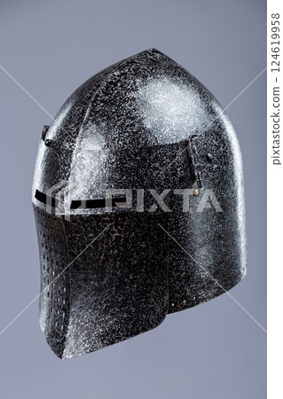 Darkened Steel Medieval Knight Helmet. Battle-worn head protection with narrow eye slits. 124619958