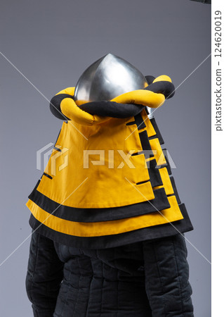 Great Helm with Wrapped Cloth. Medieval knight's helmet fully enclosing the head, with decorative fabric wrap. Great Helm with Wrapped Cloth. Medieval knight's helmet fully enclosing the head, with decorative fabric wrap. 124620019