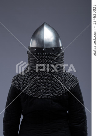 Norman Helmet with Chainmail Aventail. Medieval head protection with nasal bar and attached chainmail neck guard. Norman Helmet with Chainmail Aventail. Medieval head protection with nasal bar and attached chainmail neck guard. 124620023