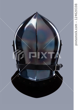 Dark Shiny Closed Helmet with Ventilation Holes. This image shows a dark, shiny helmet, possibly made of blackened steel, with a smooth, rounded shape and several small ventilation holes on the front. 124620108