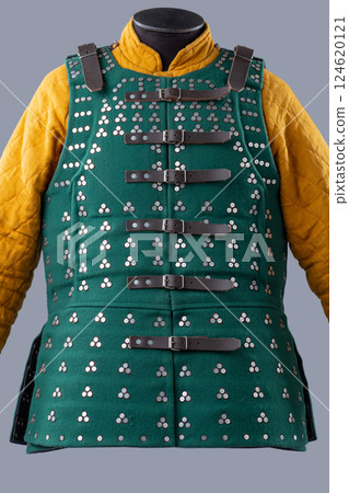 Dark Green Brigandine Armor with Studded Pattern. This image shows a dark green brigandine armor, featuring a pattern of small silver studs arranged in groups of three, and secured with black leather Dark Green Brigandine Armor with Studded Pattern. This image shows a dark green brigandine armor, featuring a pattern of small silver studs arranged in groups of three, and secured with black leather 124620121