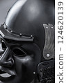 Dark Samurai Helmet with Menacing Face Mask. This image features a dark, almost black, samurai helmet with a detailed face mask displaying a fierce expression. Dark Samurai Helmet with Menacing Face Mask. This image features a dark, almost black, samurai helmet with a detailed face mask displaying a fierce expression. 124620139
