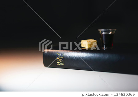 Church communion background symbolizing the holy blood and body of Jesus Christ, bread and wine and bible, Easter background during Lent 124620369