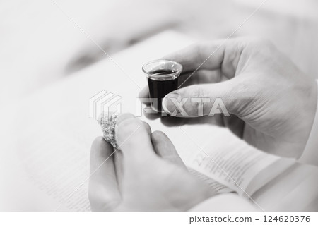 Holy Week Church Communion, Christians praying with bread and wine symbolizing the holy blood and body of Jesus, Lenten Easter background 124620376