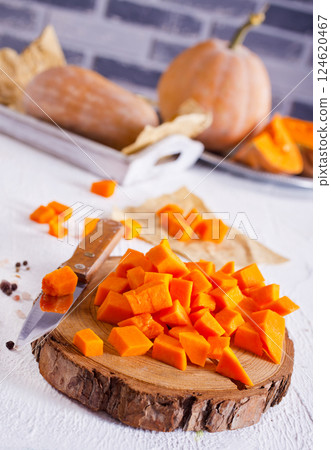 raw pumpkin on light table, fresh pumkin raw pumpkin on light table, fresh pumkin 124620467