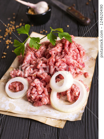 Raw minced pork. Black background. Top view. Space for text 124620490