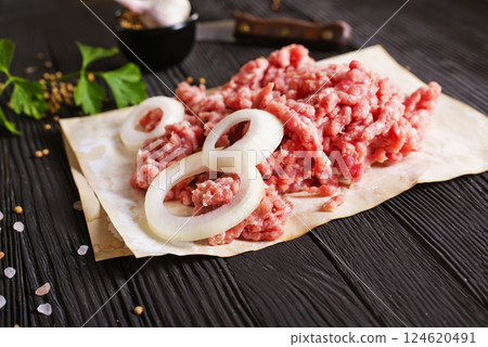Raw minced pork. Black background. Top view. Space for text 124620491