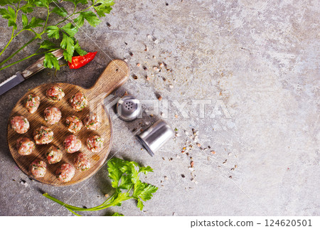 Meatballs from raw minced meat on gray table 124620501