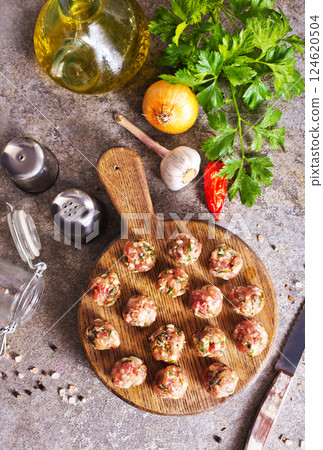 Meatballs from raw minced meat on gray table Meatballs from raw minced meat on gray table 124620504
