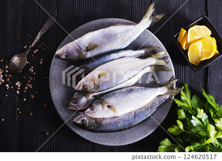 small fish on plate with spice and herb small fish on plate with spice and herb 124620517