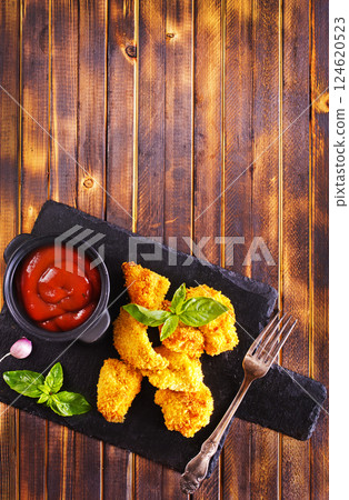 Homemade chicken nuggets are great for snacks and side dishes 124620523
