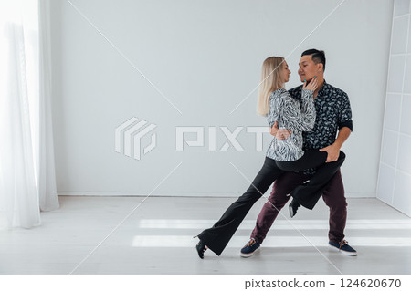 Man and woman dancing together to bachata music 124620670