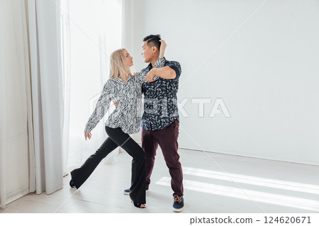 Man and woman dancing together to bachata music 124620671