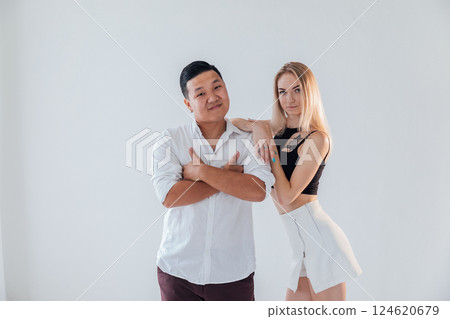 Man and woman standing side by side and hugging 124620679