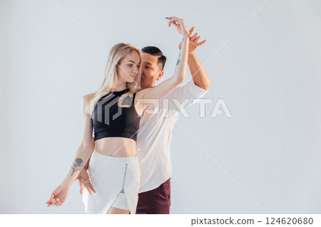Man And Woman Dancing Together To Bachata Salsa Music 124620680