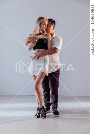 Man And Woman Dancing Together To Bachata Salsa Music 124620681