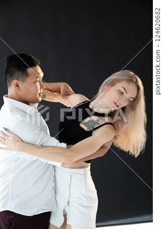 Man And Woman Dancing Together To Bachata Salsa Music 124620682