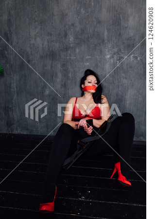 Beautiful woman in lingerie with her hands tied 124620908