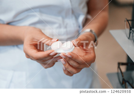 Close up view of woman's hands that holding lenses 124620938