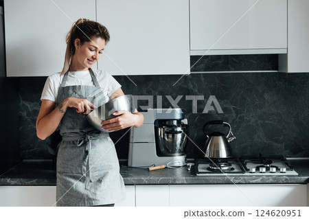 Woman preparing food cookies in the kitchen for dinner 124620951