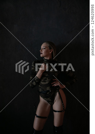 Beautiful fashionable military woman clothes and boots 124620998