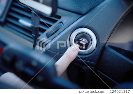 Middle-aged woman in a suit driving a car Middle-aged woman in a suit driving a car 124621517