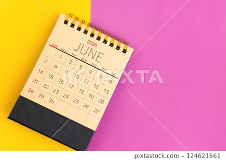June 2026 desk calendar made from brown paper page on multicolor paper. 124621661