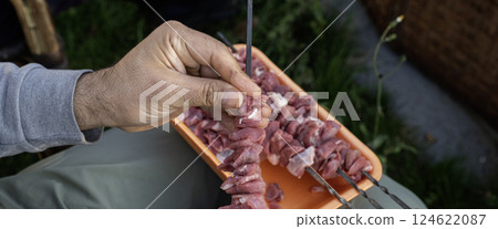 Preparing meat for grilling Preparing meat for grilling 124622087