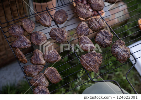 Frying cutlets on the grill, barbecue Frying cutlets on the grill, barbecue 124622091