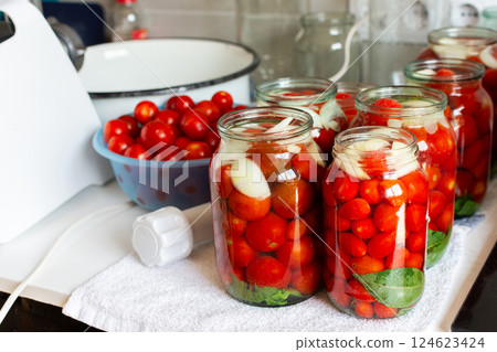 Homemade tomato preserves and tomato juice, canned and sealed for winter storage, maintaining flavor and freshness 124623424