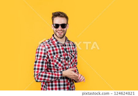 male beauty trend. bearded man with sexy bristle in glasses. facial hair and skin care. handsome man wear checkered shirt. unshaven guy in casual style. male hairdresser and barbershop. copy space 124624821