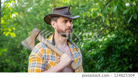 photo of rancher with axe, banner. rancher with axe. rancher with axe wearing checkered shirt. 124625304