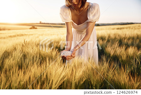Many of the objects. Close up view of perlite in woman's hands that is on the agricultural field 124626974