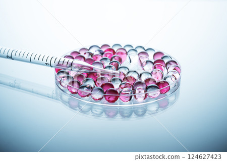 Collagen molecules in Petri dish in laboratory. Hyaluronic acid skin care, collagen serum drop. Chemical laboratory research. Collagen molecules in Petri dish in laboratory. Hyaluronic acid skin care, collagen serum drop. Chemical laboratory research. 124627423